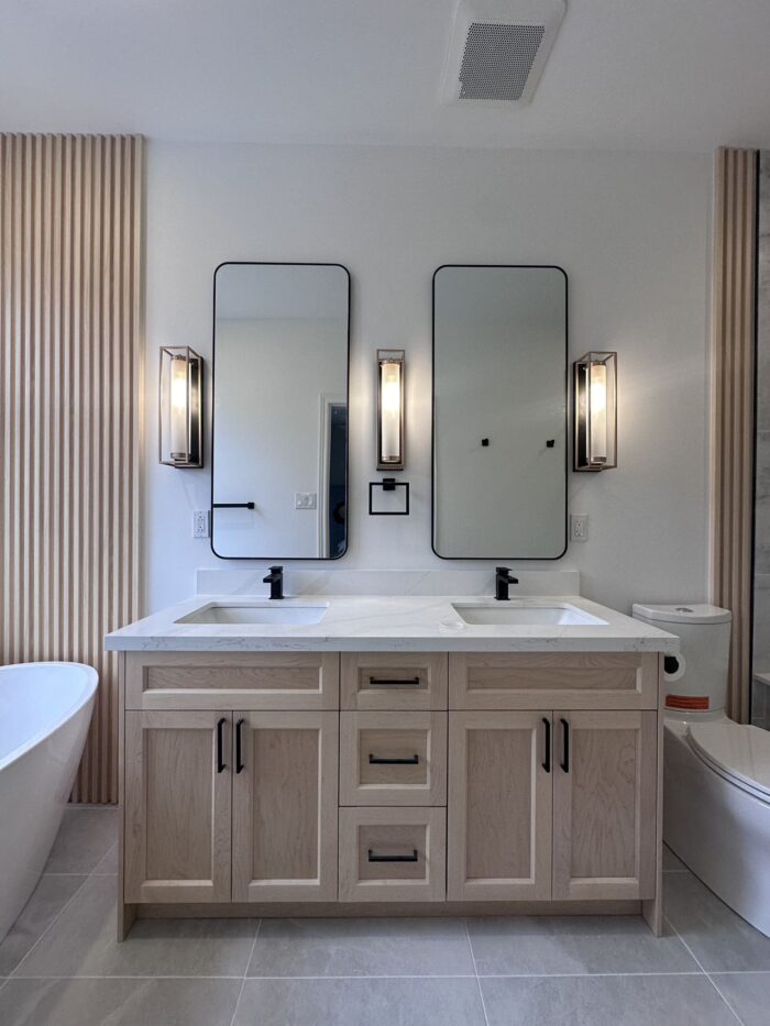 Eco-friendly and water-efficient bathroom design in Markham with low-flow fixtures and recycled materials by Lucky5 Group.