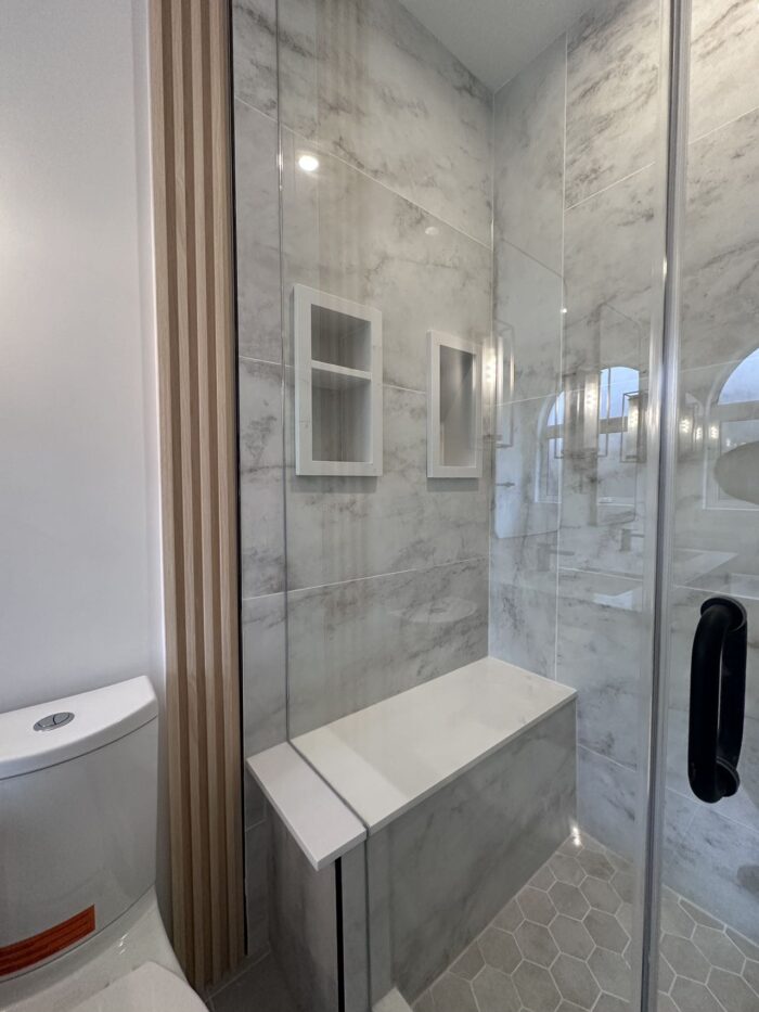Luxury spa-style bathroom in Markham with freestanding tub, rainfall shower, and heated floors, designed by Lucky5 Group.